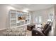 Living Room with built-in shelving and French doors leading to backyard at 16162 61St E Ln, Parrish, FL 34219