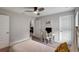 Bright bedroom with a full-size bed and a home office at 16162 61St E Ln, Parrish, FL 34219