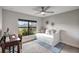 Bright bedroom with built-in desk and daybed, offering versatility at 16162 61St E Ln, Parrish, FL 34219