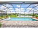 Screened pool and patio area overlooking a lake at 16162 61St E Ln, Parrish, FL 34219