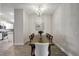Dining room with wood table, six chairs, and chandelier at 16162 61St E Ln, Parrish, FL 34219