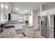 Modern kitchen with white cabinets, granite counters, and stainless steel appliances at 16162 61St E Ln, Parrish, FL 34219
