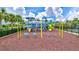 Modern playground with swings and play equipment at 16162 61St E Ln, Parrish, FL 34219