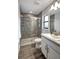 Modern bathroom with a walk-in shower and gray tile at 16162 61St E Ln, Parrish, FL 34219