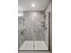 Large walk-in shower with neutral tile and glass enclosure at 16162 61St E Ln, Parrish, FL 34219