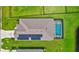 Top-down view showcasing home, pool, and solar panels at 16162 61St E Ln, Parrish, FL 34219