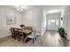 Dining room with wood table, six chairs, and chandelier at 16162 61St E Ln, Parrish, FL 34219