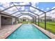 Large screened pool with fountain and pavers at 16162 61St E Ln, Parrish, FL 34219