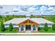 Community clubhouse with a charming design and landscaping at 16162 61St E Ln, Parrish, FL 34219