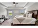 Main bedroom with a king-size bed and plenty of natural light at 16162 61St E Ln, Parrish, FL 34219