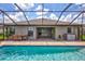 Inviting pool area with covered patio and brick pavers at 16162 61St E Ln, Parrish, FL 34219