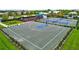 Full-size outdoor basketball court with blue accents at 16162 61St E Ln, Parrish, FL 34219