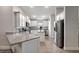 Modern kitchen with white cabinets, granite counters, and stainless steel appliances at 16162 61St E Ln, Parrish, FL 34219
