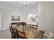 Dining room with wood table, six chairs, and chandelier at 16162 61St E Ln, Parrish, FL 34219