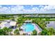 Community pool and surrounding homes and landscape at 16162 61St E Ln, Parrish, FL 34219