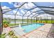 Screened pool with fountain, pavers, and lake view at 16162 61St E Ln, Parrish, FL 34219