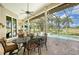 Screened patio with pool and golf course view at 2570 Tom Morris Dr, Sarasota, FL 34240