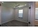 Bright bedroom features a ceiling fan, a large window, wood-look floors, and neutral-colored walls at 5107 Whispering Oaks Dr, North Port, FL 34287
