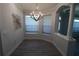 Charming dining room with modern decor, chandelier and lots of natural light at 5107 Whispering Oaks Dr, North Port, FL 34287