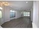 Bright living room area featuring luxury flooring and large windows at 5107 Whispering Oaks Dr, North Port, FL 34287