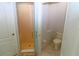 Clean bathroom featuring a shower, toilet, and marble flooring at 5107 Whispering Oaks Dr, North Port, FL 34287