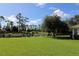 Scenic view of a tranquil canal and lush green landscape at 5107 Whispering Oaks Dr, North Port, FL 34287