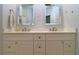 Modern bathroom with double vanity and stylish tile backsplash at 5107 Whispering Oaks Dr, North Port, FL 34287