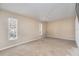 Well-lit bedroom with neutral walls and carpeted floor at 4907 21St E Way, Bradenton, FL 34203