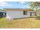 View of house exterior and backyard with fence at 4907 21St E Way, Bradenton, FL 34203