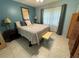 Spacious bedroom with a queen-size bed and plenty of light at 5850 Welcome Rd # J6, Bradenton, FL 34207