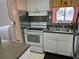 Modern kitchen with stainless steel appliances and white cabinets at 5850 Welcome Rd # J6, Bradenton, FL 34207