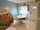 Charming dining area with a white table and chairs at 5850 Welcome Rd # J6, Bradenton, FL 34207