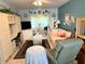 Living room with a couch, recliner, and built-in entertainment center at 5850 Welcome Rd # J6, Bradenton, FL 34207