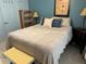 Comfortable bedroom with a queen-size bed and a dresser at 5850 Welcome Rd # J6, Bradenton, FL 34207