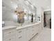 Luxurious bathroom with double vanity and marble tile at 3973 Boca Pointe Dr, Sarasota, FL 34238