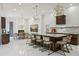 Modern kitchen featuring a large island and marble countertops at 3973 Boca Pointe Dr, Sarasota, FL 34238