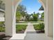 Bright entryway with arched walkway and view of neighborhood at 3973 Boca Pointe Dr, Sarasota, FL 34238