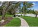 Relaxing patio area with seating overlooking a tranquil lake at 3973 Boca Pointe Dr, Sarasota, FL 34238
