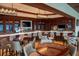 Elegant clubhouse bar with seating and modern lighting at 3973 Boca Pointe Dr, Sarasota, FL 34238