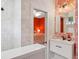 Bathroom with coral wallpaper and white vanity at 3973 Boca Pointe Dr, Sarasota, FL 34238