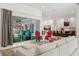 Spacious living area with views of the pool and kitchen, and comfortable seating at 3973 Boca Pointe Dr, Sarasota, FL 34238