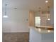 Kitchen boasts an island with seating, light-colored cabinetry and tile flooring at 4939 Lakescene Pl, Sarasota, FL 34243