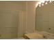 Clean bathroom with shower/tub combo, vanity, and large mirror at 4939 Lakescene Pl, Sarasota, FL 34243