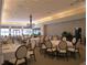 Elegant dining room featuring tables, chairs, and a chandelier at 4939 Lakescene Pl, Sarasota, FL 34243