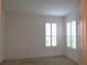 Bright bedroom with neutral walls and window shutters at 4939 Lakescene Pl, Sarasota, FL 34243