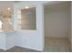 Breakfast nook with built-in shelving and a view to the kitchen at 4939 Lakescene Pl, Sarasota, FL 34243