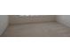 Empty bedroom with neutral carpeting and light walls at 4939 Lakescene Pl, Sarasota, FL 34243