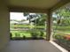 Relaxing screened patio with scenic views of the lake and community at 4939 Lakescene Pl, Sarasota, FL 34243