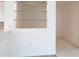 Built-in glass shelving in a breakfast nook at 4939 Lakescene Pl, Sarasota, FL 34243