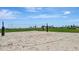 Beach volleyball court with sand and net at 10254 Morning Mist Ln, Sarasota, FL 34241